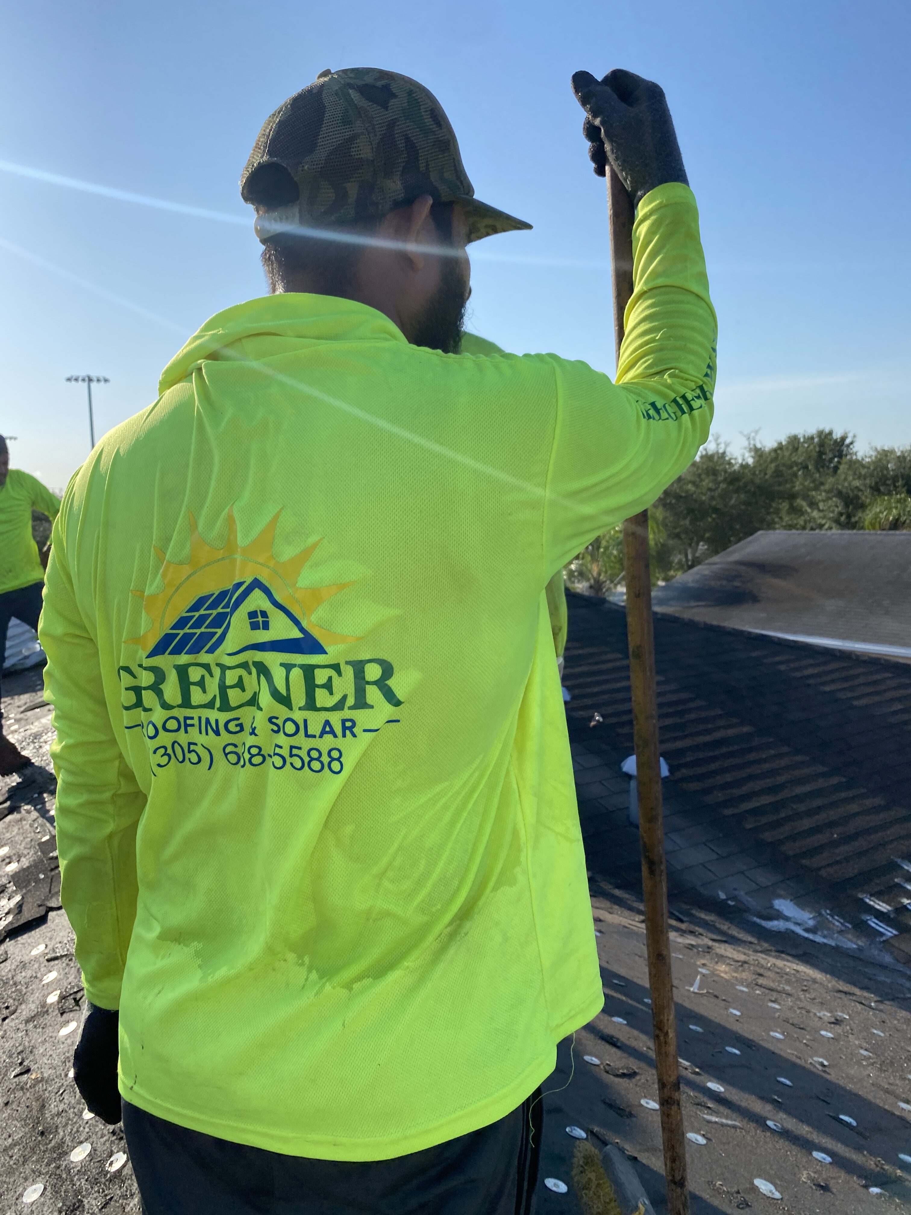 two solar installation staff discussing the plan